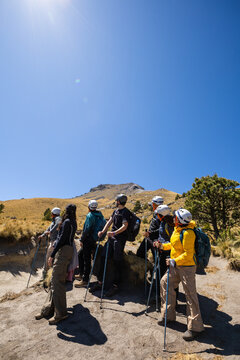 Group of hikers embarking on a mountain adventure