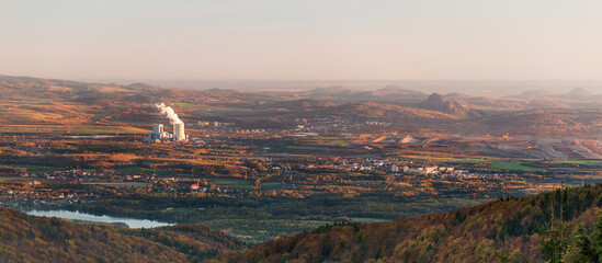 View over Bohemai from the Ore mountains at sunset with a coal power station in background