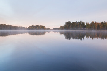Fototapeta premium Autumnal lake scenery in Sweden during sunrise