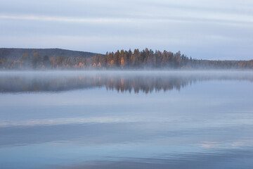 Fototapeta premium Autumnal lake scenery in Sweden during sunset