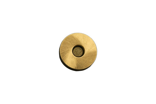 Round brass magnetic snap fastener for bags is isolated.