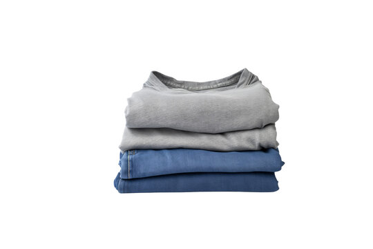 Neatly folded stack of grey t-shirts and blue jeans, ready for storage. background removed