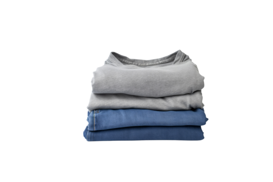 Neatly folded stack of grey t-shirts and blue jeans, ready for storage. background removed