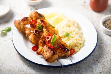 Chicken skewers with couscous and lime