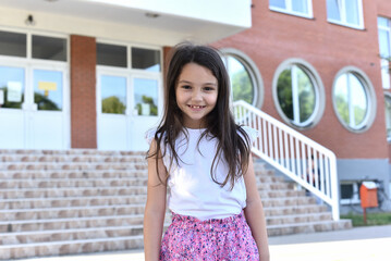 Portrait of a little smiling 8-year-old girl