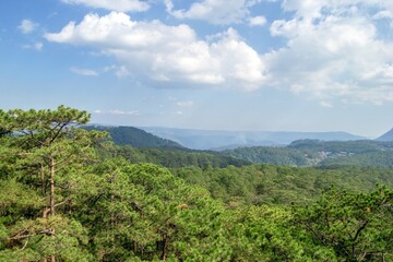 Lush Green Mountain Landscape with Blue Sky and Clouds, Peaceful Scenery. Dalat, Vietnam.