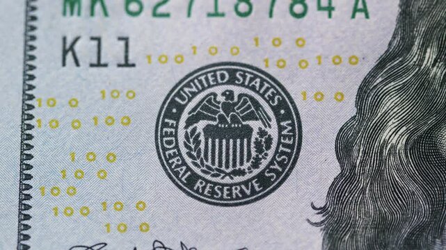 The seal of the United States Federal Reserve System prominently displayed on a banknote