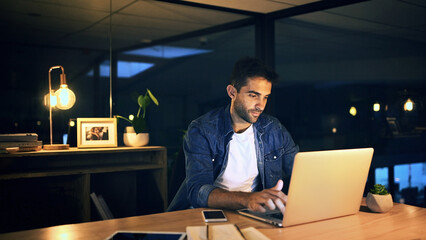 Office, night and businessman with laptop for editing, proofreading and website for news article....