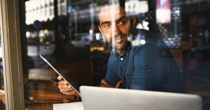 Thinking, glass window and man in coffee shop, tablet and graphic designer with email for project. Happy, freelancer and entrepreneur in cafe, app and creativity with website info, smile and decision - Powered by Adobe