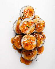 Enjoy our delicious sushi rolls with sweet sauce and sesame