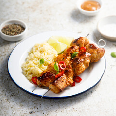 Chicken skewers with couscous and lime
