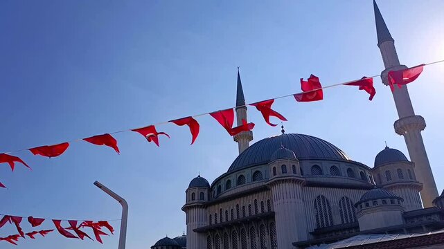 Turkish flag garland waving in the wind against the mosque and the blue sky