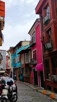 Colorful buildings in Balat district, Istanbul. Dynamic handheld shot of the street
