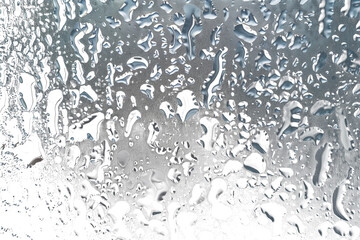 Water condensation droplets on black glass surface