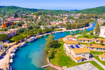 Messonghi Beach holiday resort over canal separating Moraitika and Messonghi villages on a Corfu Island, Greece