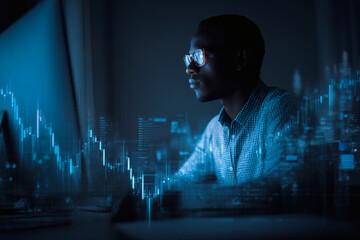 A man using laptop computer analyzing data and stock market