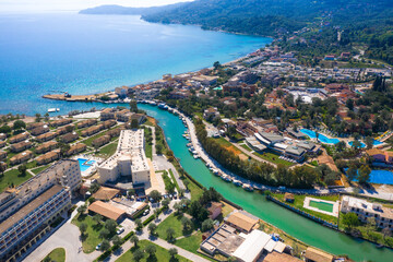 Messonghi Beach holiday resort over canal separating Moraitika and Messonghi villages on a Corfu Island, Greece