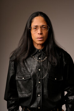 Portrait of a Latin man in a leather shirt and glasses