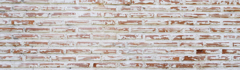 old brick wall, red and white colour, broken bricks, peeling plaster, vintage texture, background for banner, copy space. pattern,  panel, building outdoor design. Interior of a modern loft. 