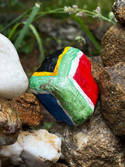 brazilian colored stone left for good luck on the pilgrimage along the road to Santiago in Portugal, Caminho Portugues