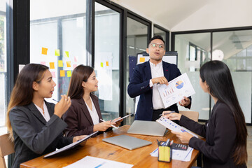 Group of business people working together with dashboard analysis and data management a meeting...