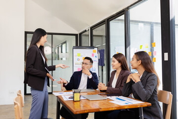Group of Asian business working plan analysis project brainstorm in modern office, Asian...