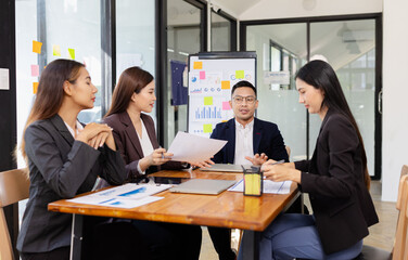 Group of Asian business working plan analysis project brainstorm in modern office, Asian...
