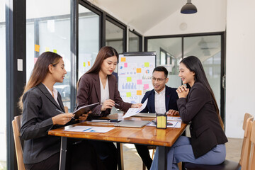 Group of Asian business working plan analysis project brainstorm in modern office, Asian...