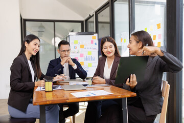 Group of Asian business working plan analysis project brainstorm in modern office, Asian businesspeople team working together, Business startup and company strategy planning concept.
