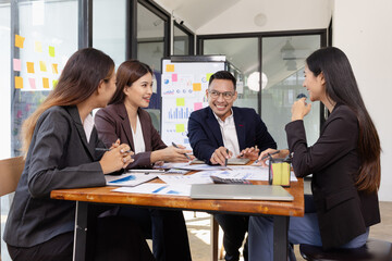 Group of Asian business working plan analysis project brainstorm in modern office, Asian...