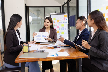 Group of Asian business working plan analysis project brainstorm in modern office, Asian...