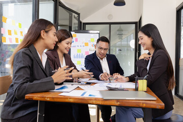 Group of Asian business working plan analysis project brainstorm in modern office, Asian...