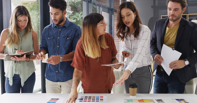 Color swatch, talking or people in meeting for brand choice, approval decision or planning. Teamwork, review or creative project manager with group, tablet or designers for company identity or task