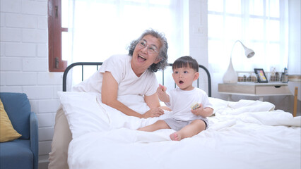 Fototapeta premium Before putting the kids to bed, grandparents, and kid unwind and play