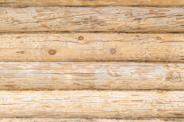 Horizontal wooden logs showcasing natural textures. Log house wall