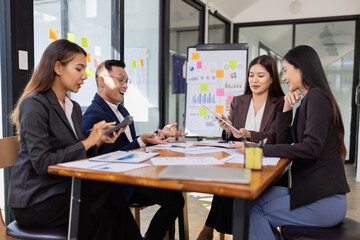 Group of Asian business working plan analysis project brainstorm in modern office, Asian businesspeople team working together, Business startup and company strategy planning concept.
