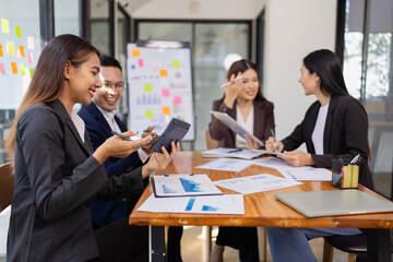 Group of Asian business working plan analysis project brainstorm in modern office, Asian businesspeople team working together, Business startup and company strategy planning concept.
