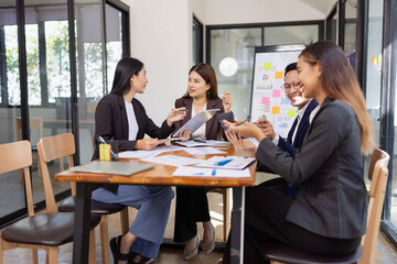 Group of Asian business working plan analysis project brainstorm in modern office, Asian...