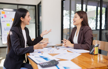 Businesswomen working plan analysis project brainstorm in modern office, Asian businesspeople team...