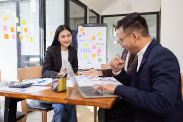 Group of Asian business working plan analysis project brainstorm in modern office, Asian businesspeople team working together, Business startup and company strategy planning concept.
