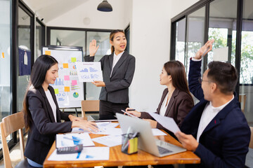 Group of Asian business working plan analysis project brainstorm in modern office, Asian businesspeople team working together, Business startup and company strategy planning concept.
