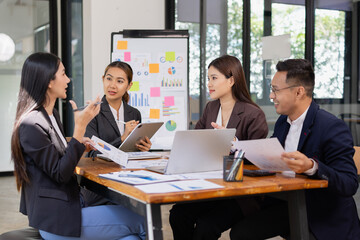 Group of Asian business working with analysis project brainstorm in modern office, Asian...