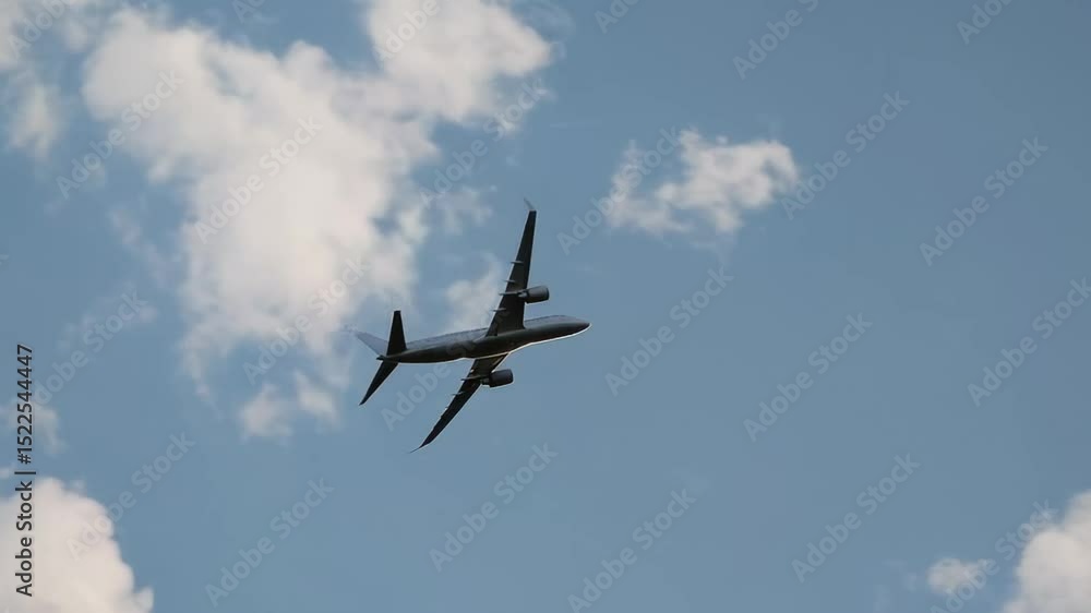 Poster passenger jet gradually descending through white cumulus clouds, preparing for airport landing with 