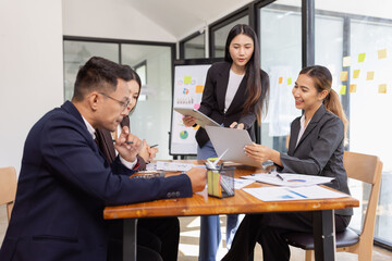 Group of Asian business working with analysis project brainstorm in modern office, Asian...
