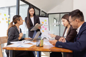 Group of Asian business working with analysis project brainstorm in modern office, Asian...