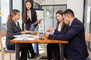 Group of Asian business working with analysis project brainstorm in modern office, Asian...