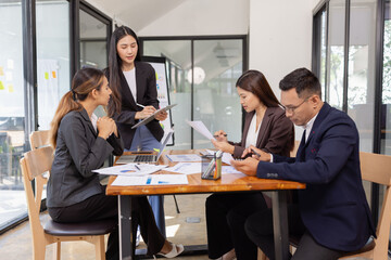 Group of Asian business working with analysis project brainstorm in modern office, Asian...