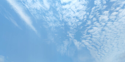 Blue sky and white clouds background. Panorama of sky.