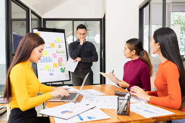Fototapeta premium Group of Asian business working analysis project brainstorm in modern office, Asian businesspeople team working together, Business startup and company strategy planning concept.