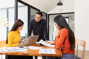 Group of Asian business working analysis project brainstorm in modern office, Asian businesspeople...